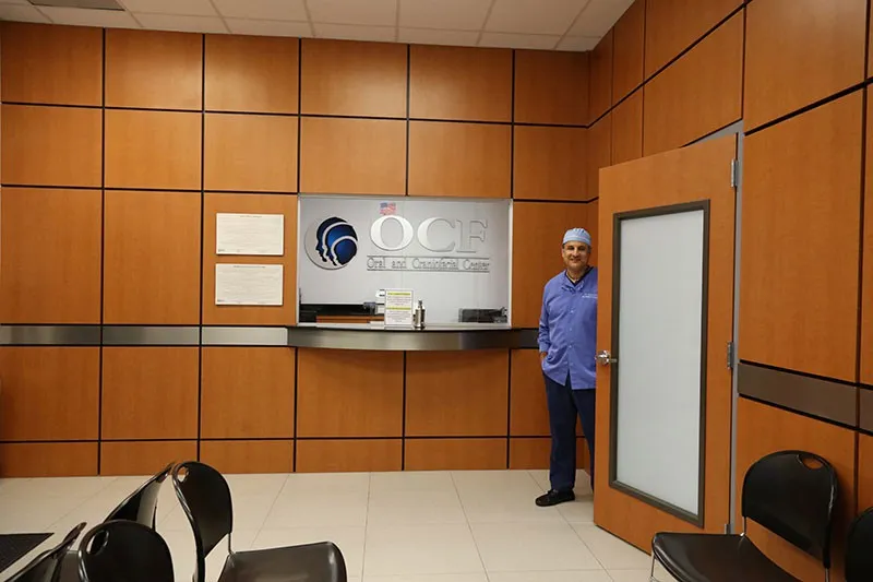 Dr. Carlos Cruz standing in waiting room