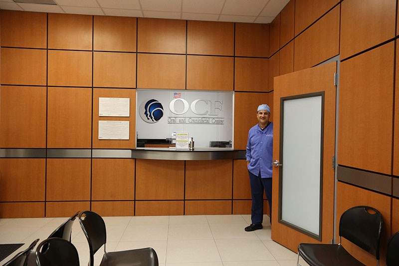 Dr. Carlos Cruz standing in waiting room