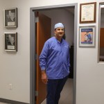 Dr. Carlos Cruz standing in hallway